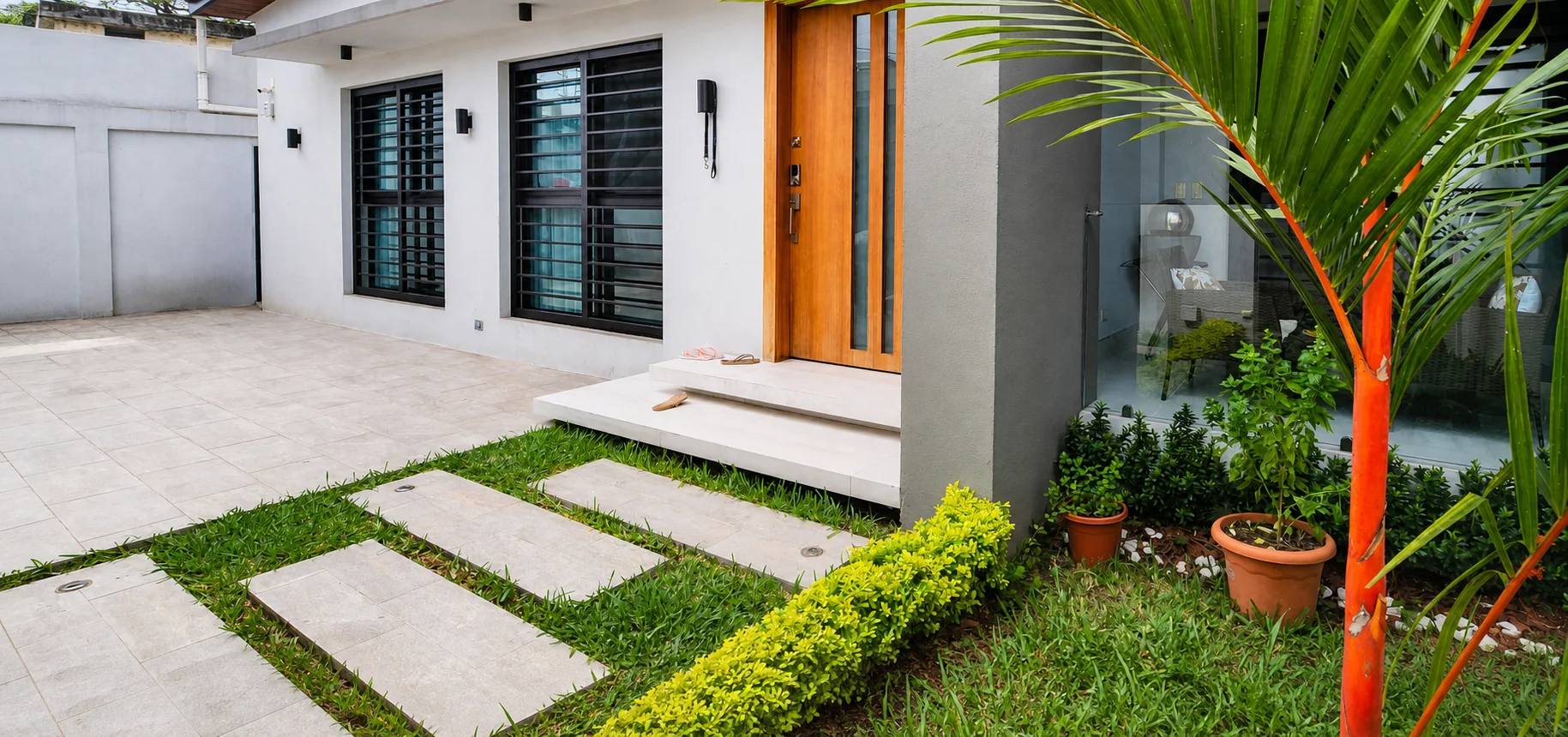 Vivienda contemporánea terminada con paisajismo frontal
